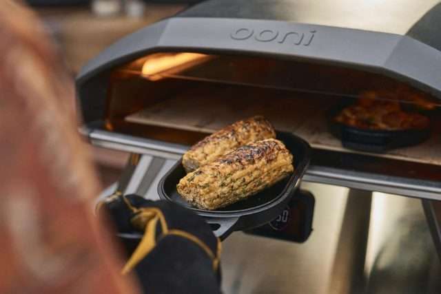 Ooni Koda 2 Pro Cooking corn in cast iron cookware